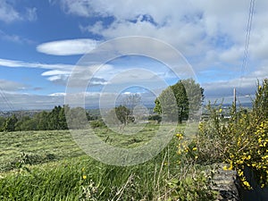 Freshly mown fields, set against a cloudy sky near, Wilsden, Yorkshire, UK