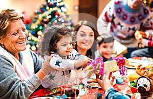 Large multi generation family having fun at christmas home supper - Winter holiday x mas concept with parents and children