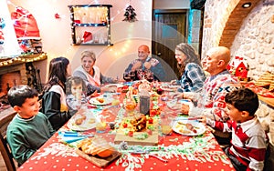 Large multi generation family having fun at holidays dinner event - Winter x mas concept about grand parents eating together