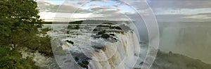 Large nature panorama of Iguacu (Iguazu) waterfall cascade on border of Brazil and Argentina