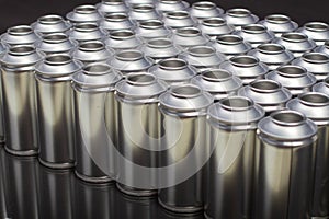A large number of aerosol cans on a black background photo