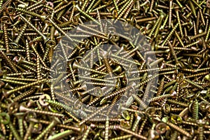 Large number of metal, steel screws. Close-up. Background and texture. Macro