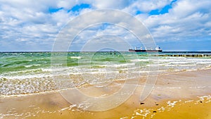 Large Ocean Freighter coming from the North Sea heading into in the Westerschelde to the harbor of Vlissingen