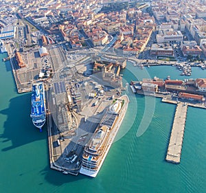 Large ocean liners are moored in the seaport of Livorno, Italy