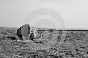 Large old boulder or standing stone on midgley moor in west yorkshire known as robin hoods penny stone