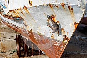 Large old iron rusting ship in dry dock