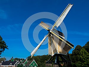 A large old mill in Arnhem, Netherlands. The wind mill is used to grind grain.