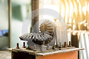 Large old and rusty cog wheels with selective focus.