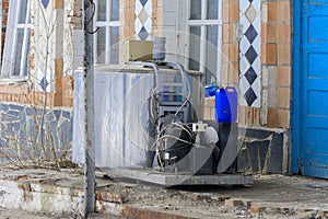 A large old tank for collecting milk in an abandoned