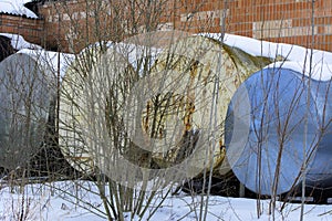 A large old tank for collecting milk in an abandoned