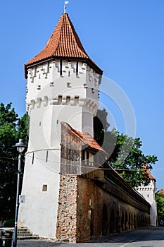 Large old white painted stone tower in the historical center of the Sibiu city, near Citadel Street and Park Strada si Parcul