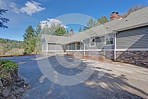 Large one story home exterior with gray siding