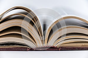 Large open book. Encyclopedia in red hardcover. Close-up. Selective Focus