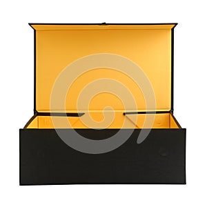 Large open cardboard packing box, covered with black cloth, close-up, isolated on white background