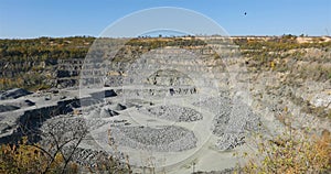 Large open iron ore quarry, panorama of a large stone quarry, equipment in the quarry, Open pit working process, quarry
