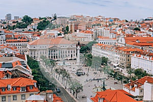 A large orange building. View of the Roscio square. Lisbon Portugal. View of the rooftops of Lisbon. Portugal