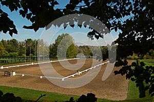 large outdoor dressage ring or arena with sand footing