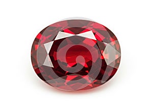 A large oval cut ruby gemstone on a white background
