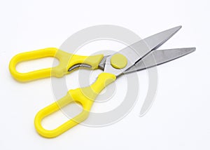 A large pair of scissors with yellow handles