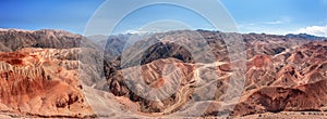 Large panoramic aerial view captures the raw beauty of rugged red mountains