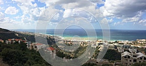 Large panoramic view of the mediterranean lebanese shore  near the mouth of the river called Nahr Ibrahim photo