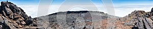 Large panoramic view of the pit crater at the top of the stratovolcano Mt Pico, Azores, taken from its pinnacle photo