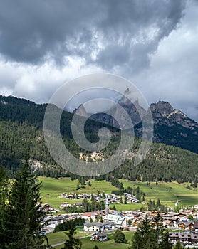 Large panoramic view of Pozza di Fassa, a commune at the northern Italia