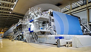 Large paper mill machine in workshop