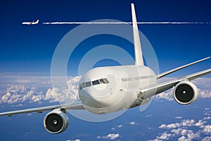 Large passenger plane in blue sky