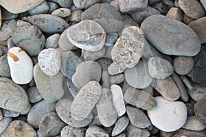 Large pebbles under the water surface photo background summer sea