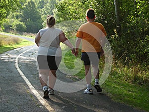 Large people walking on trail