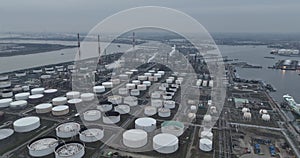 Large petrochemical cracking refinery in the port of Antwerp. Producing fossil fuels. Aerial dorne view at dusk. Large