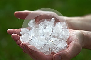 large pieces of ice hail in the palm of your hand.