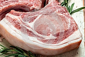 Large pieces of Raw Pork meat chop steak. Food recipe background. Close up