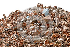 A large pile of broken red bricks, fragments of tiles and concrete, isolated on a white background. Remains of a