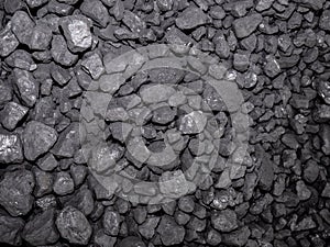 A large pile of carbon stones piled up for subsequent combustion, forming an energetic background of this precious mineral photo