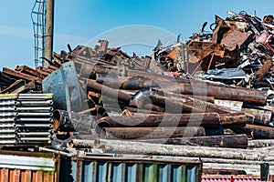 Large pile of collected scrap metal for recycling on the territory of the metal collection point