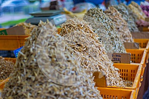 A large pile of dried fish on a market stall in Kuala Lumpur`s fresh market. Dry small fish, crispy, usually part of the