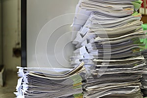 A large pile of paper stacks of old papers