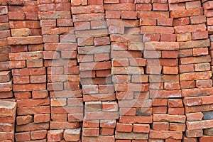 Large pile of red bricks background