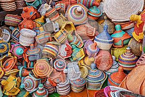 large pile of various wicker hand made baskets for sale on the local African market. Traditional craftsmanship and art hobby