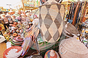 large pile of various wicker hand made baskets for sale on the local African market. Traditional craftsmanship and art hobby