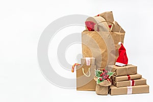 A large pile of wrapped holiday gifts on a white background. New year and christmas concept