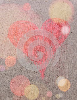 Large pink chalk heart with light flares