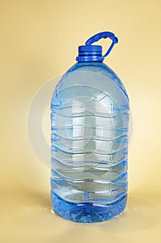 A large plastic bottle of drinking water of 5 liters. A bottle of water. The concept of quenching thirst in summer.