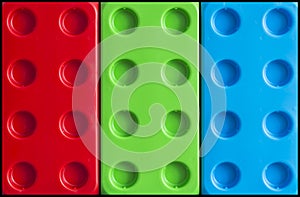 Large plastic building blocks toy in RGB colors as a background. Three Primary Colors, Red, Green and Blue