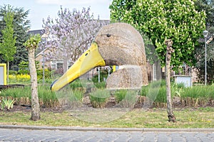 Large plastic duck on a roundabout