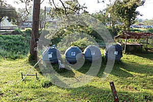 Large plastic tanks for storing water for use in rural areas.