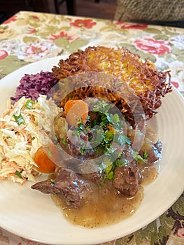 large pork chop, breading on the cutlet, mashed potatoes, lunch dish photo