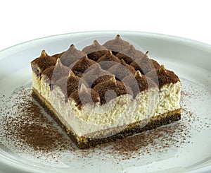 large portion of tiramisu, typical Italian dessert made with cream, mascarpone, cocoa and coffee